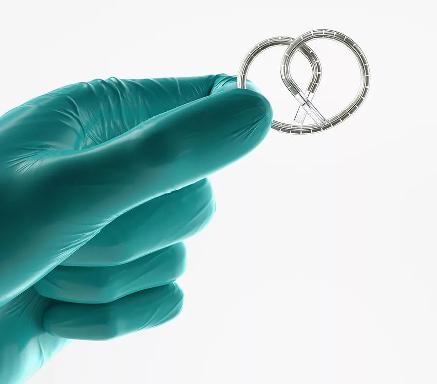 gloved-hand-holding-twisted-wire