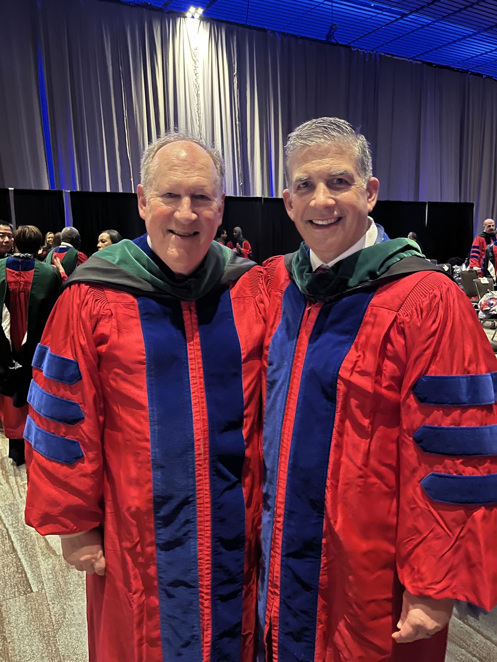two-men-in-red-blue-robes