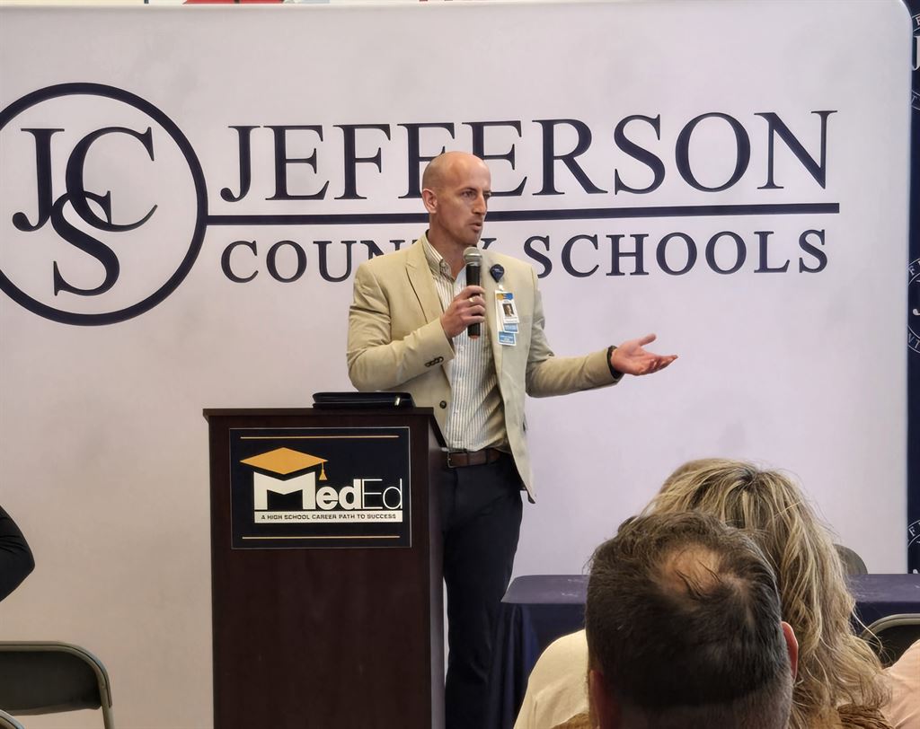 WVU Hospitals East Associate Vice President of Ambulatory Operations Alex Johnson speaks at a MedEd Program signing ceremony in Jefferson County, West Virginia.