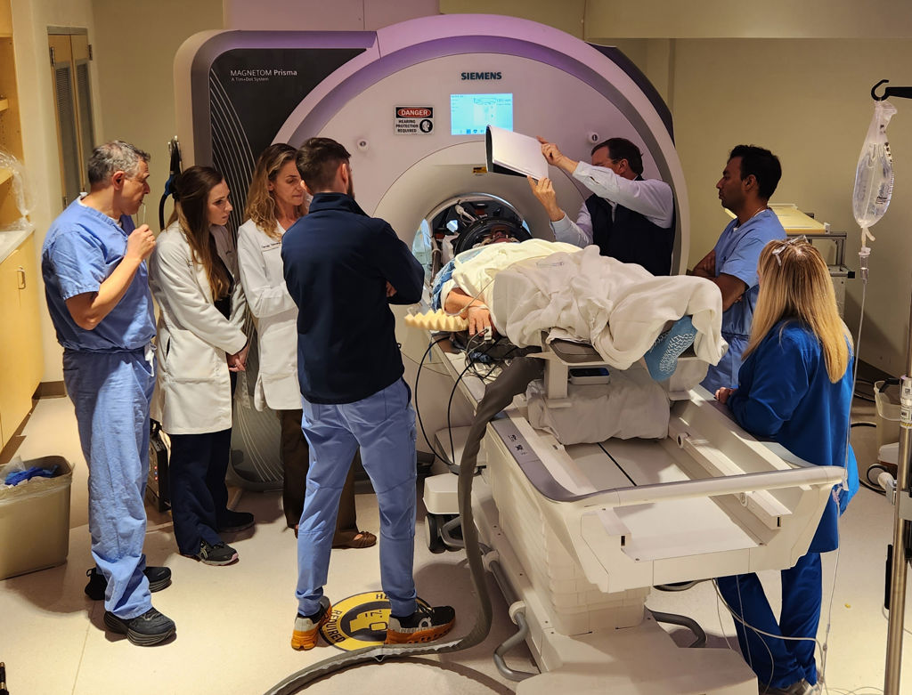 An Alzheimer&rsquo;s patient undergoes focused ultrasound treatment with the WVU RNI team.