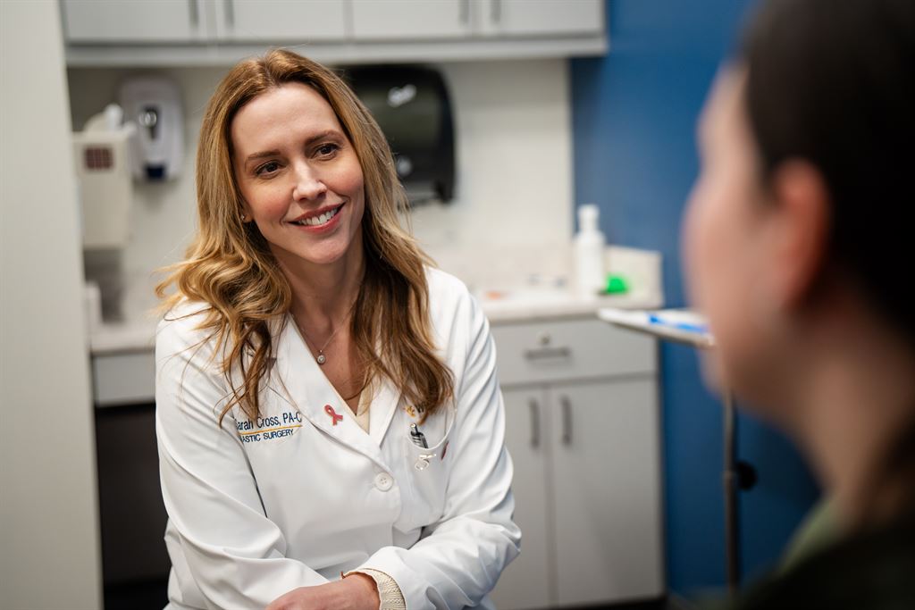 Sarah Cross, PA-C, speaks with a patient at WVU Medicine Plastic Surgery in Shepherdstown.