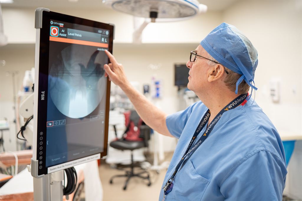 Dr. Garth Wright points out imaging with OrthoGrid technology at WVU Medicine Jefferson Medical Center.