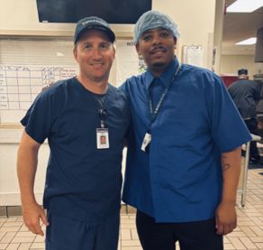 Mark O'Hern and Jermaine Streeter pose for a photo at WVU Medicine Berkeley Medical Center's cafeteria.