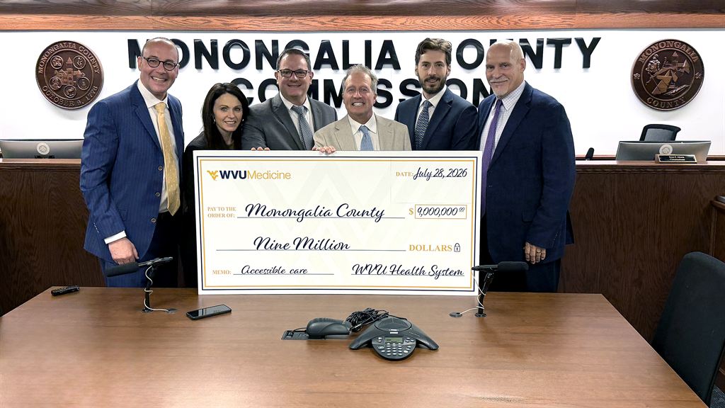 5-men-1-woman-holding-9mil-check