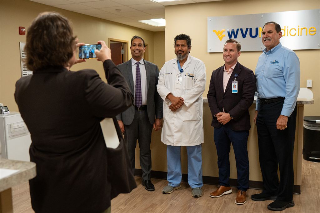 Mark O'Hern poses for a photo with Hagerstown-area WVU Medicine providers and guests at a recent open house.