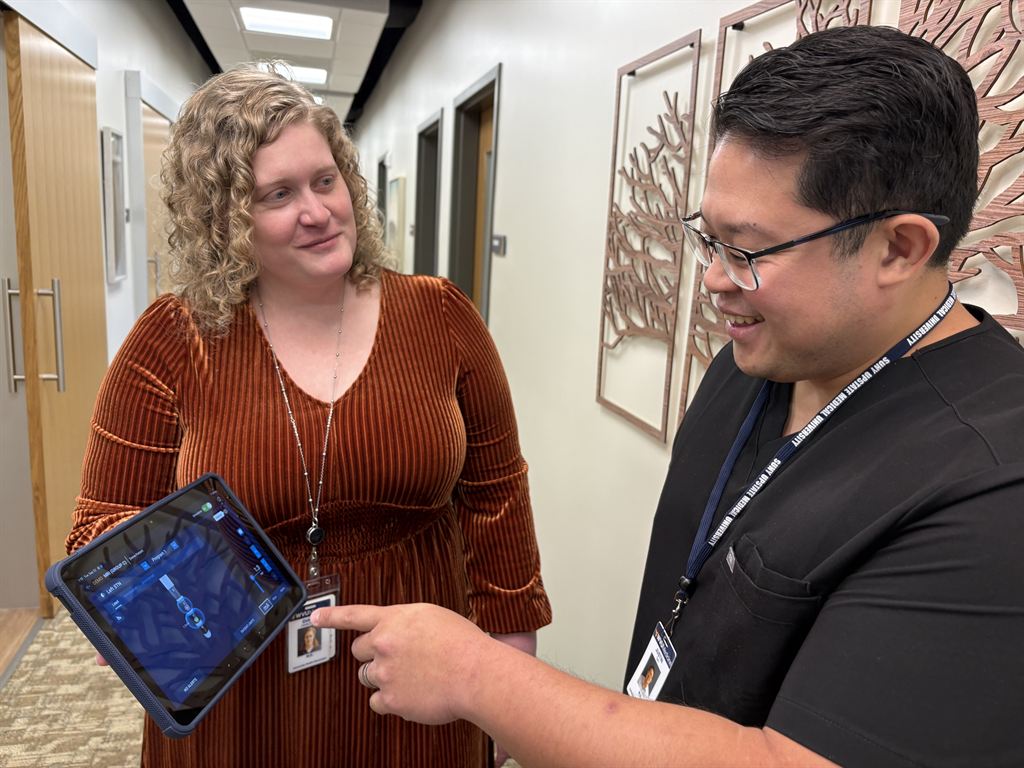 Drs. Diana Hancock, left, and Justin Oh look at images on a tablet together at the new Movement Disorder Clinic in Berkeley County.