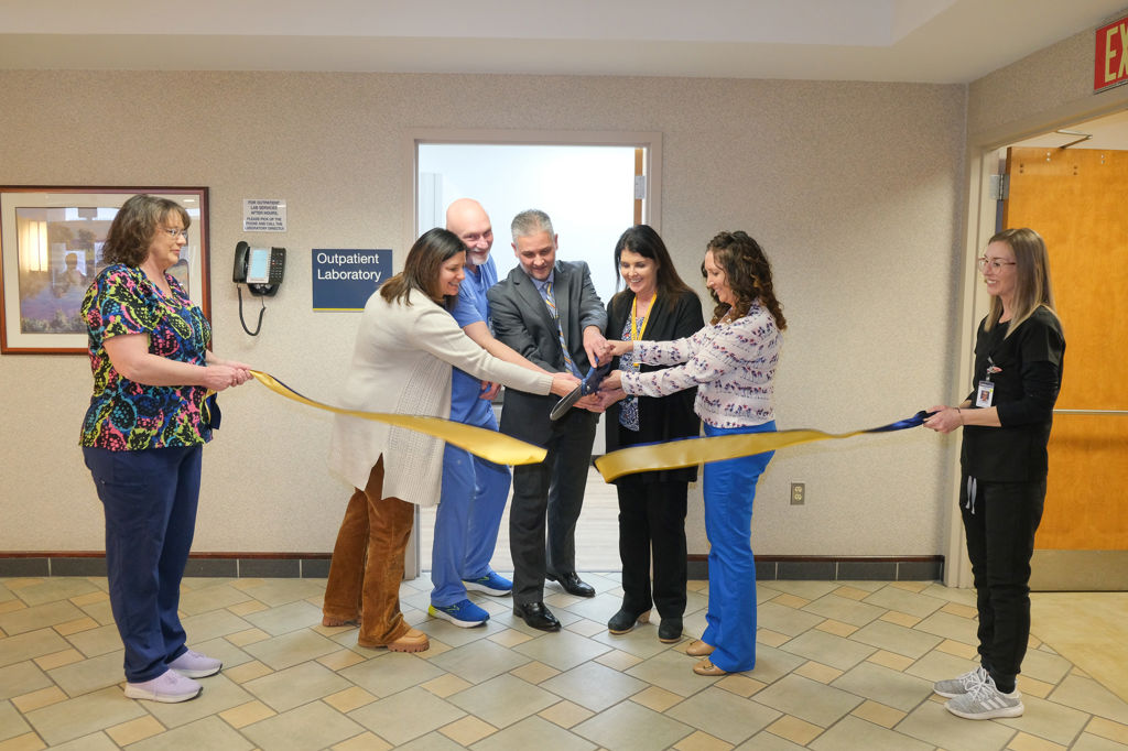 PCH administrators and lab personnel cut the ribbon to open the new lab space.