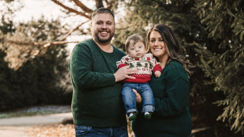 man-and-woman-holding-toddler