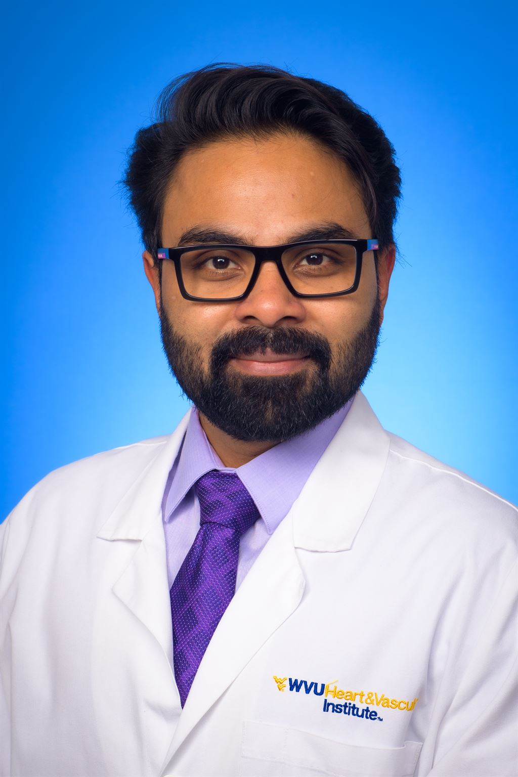 bearded-man-with-glasses-wearing-doctors-coat